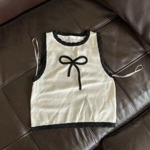 Cream Knit Sleeveless Top with Black Trim and Bow